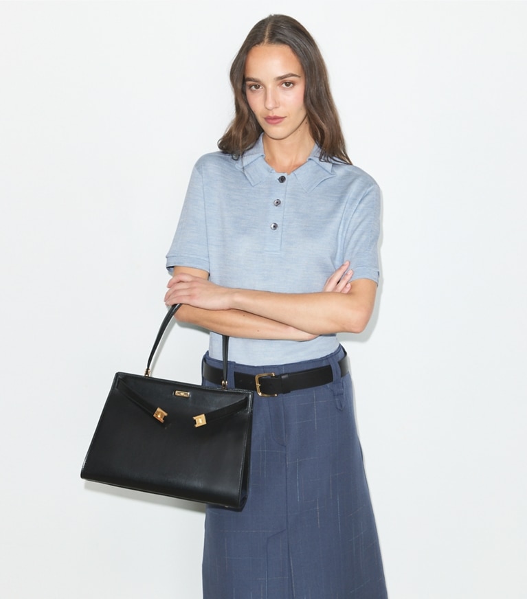 Tory Burch designer tote bags Classic Lee Radziwill Bag in Black / GOLD accessory on model
