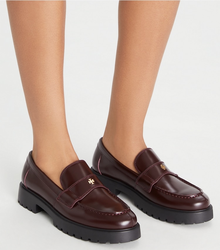 Tory Burch designer flats Classic Lug Loafer in PLUM accessory on model