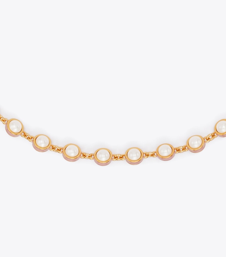 Tory Burch designer collane Collana con perla Moondance in Light Brass / Pearl / Pink dettaglio
