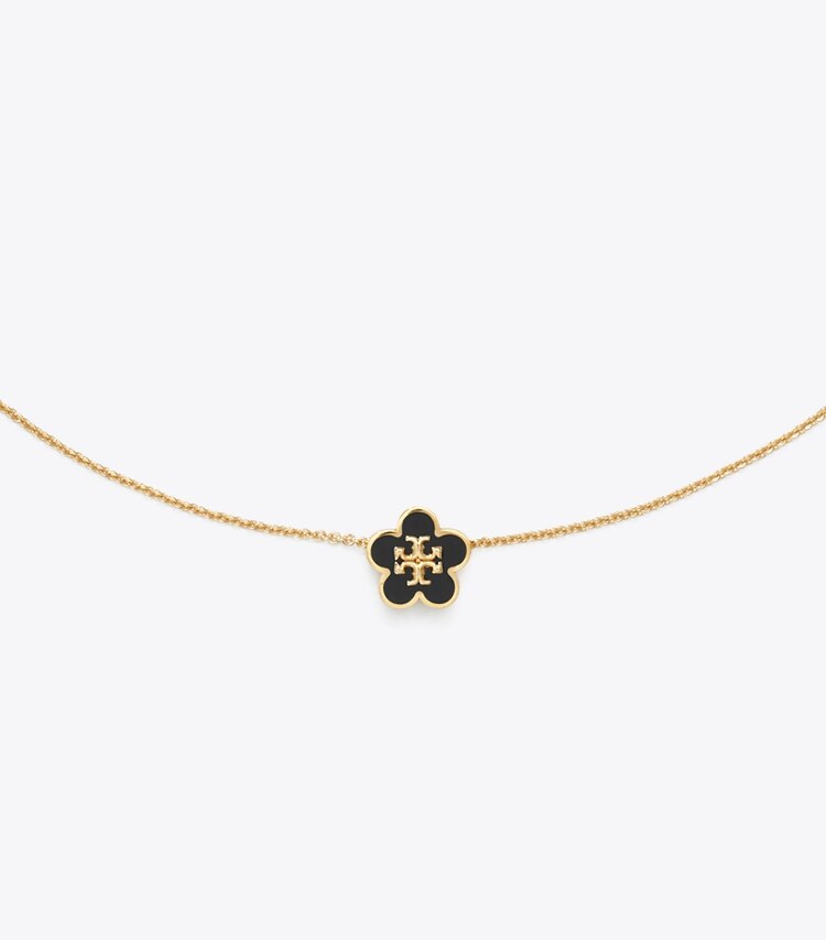 Tory Burch designer collane Collana Forget Me Not con pendente a fiore smaltato in Tory Gold / Black dettaglio