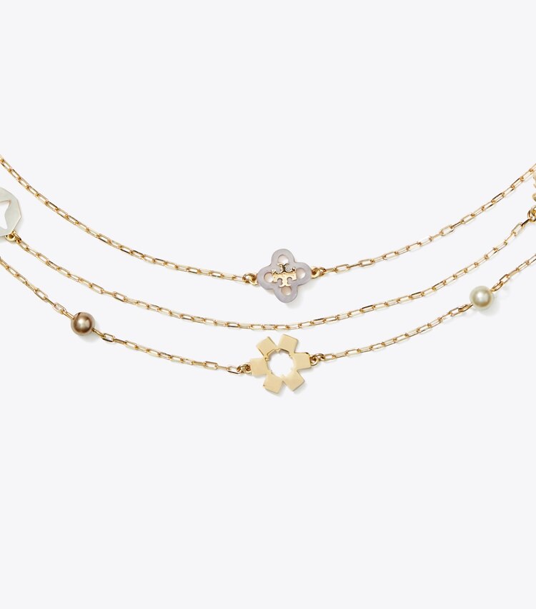 Tory Burch designer collane Collana Kira Clover a tre fili in Tory Gold / Pearl / Mother of Pearl dettaglio