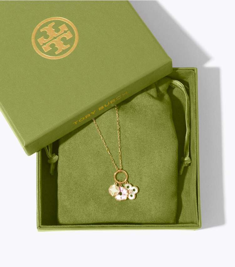 Tory Burch diseñador collares Collar con colgante de dije Forget Me Not en Tory Gold / Mother of Pearl editorial