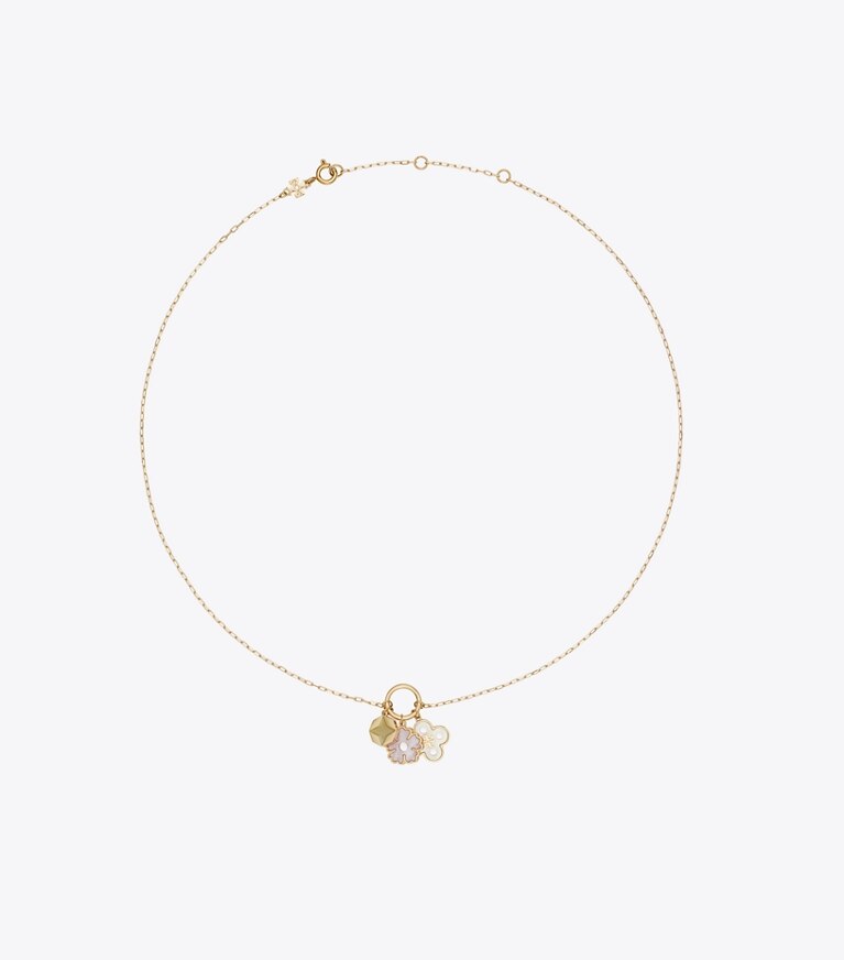 Tory Burch diseñador collares Collar con colgante de dije Forget Me Not en Tory Gold / Mother of Pearl frente
