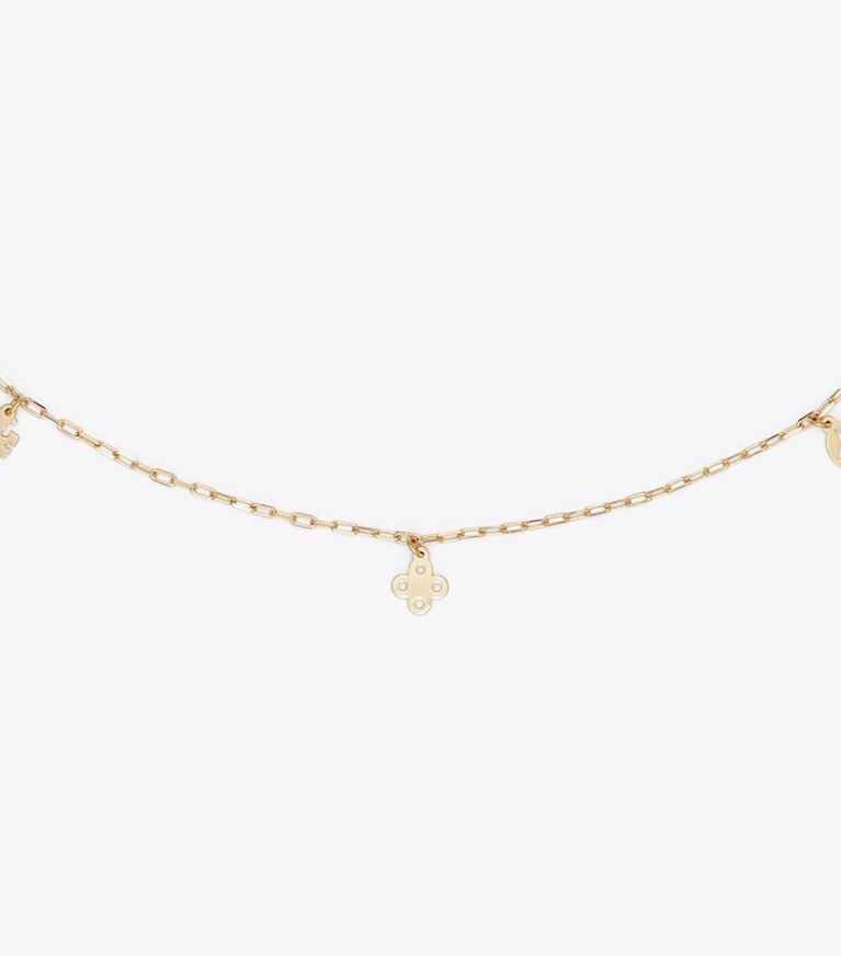 Tory Burch diseñador collares Collar con dije Forget Me Not en Tory Gold detalle