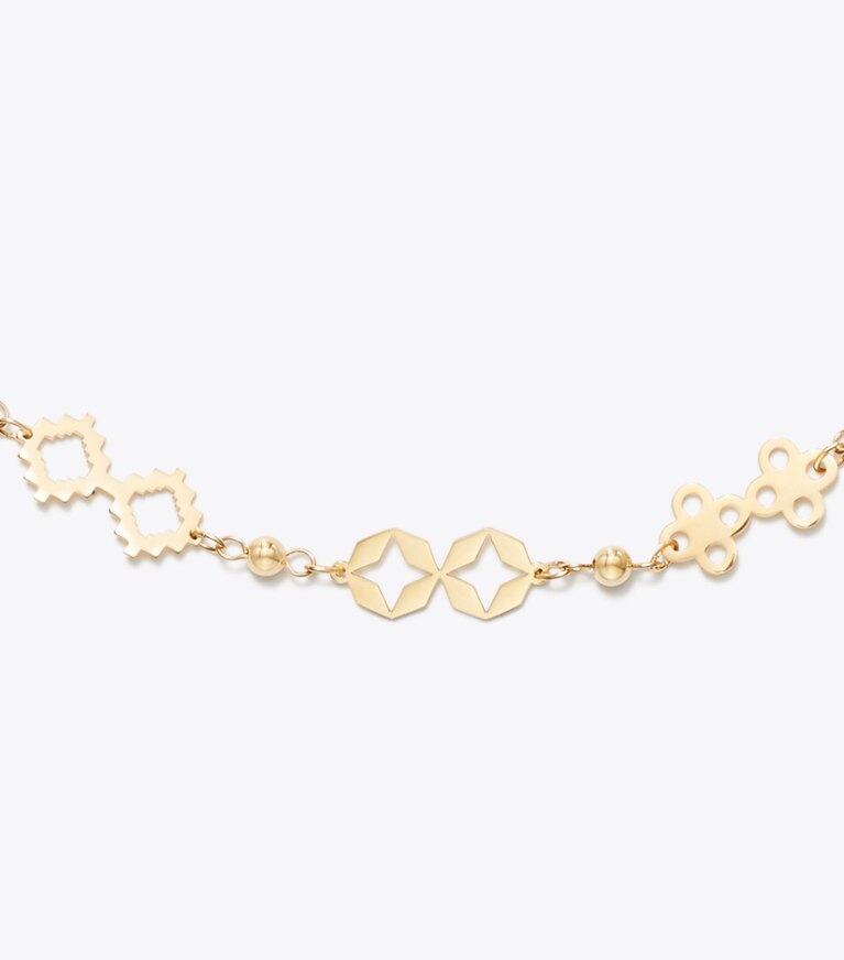 Tory Burch diseñador collares Collar con trébol Forget Me Not en Tory Gold detalle