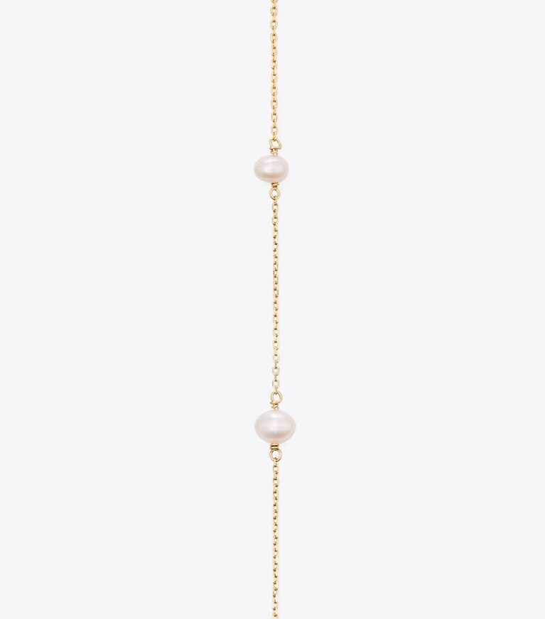 Tory Burch diseñador collares Collar largo de perlas Moondance en Tory Gold / Pearl detalle