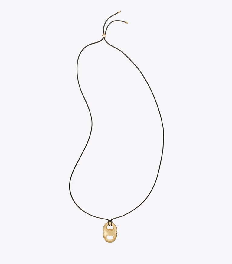 Tory Burch designer colliers Collier à pendentif Gémeaux dans Light Brass / Black de face