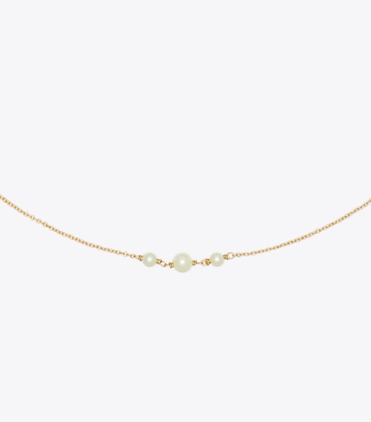 Tory Burch designer colliers Collier délicat Moondance avec perle et étoile in Tory Gold / Crystal / Pearl informations