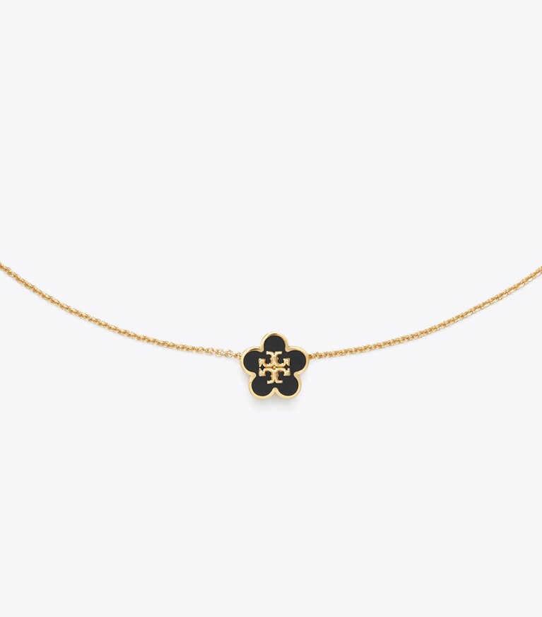 Tory Burch designer colliers Collier Forget Me Not à pendentif fleur en émail in Tory Gold / Black informations