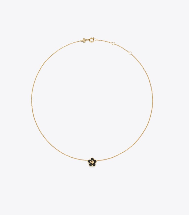Tory Burch designer colliers Collier Forget Me Not à pendentif fleur en émail in Tory Gold / Black front