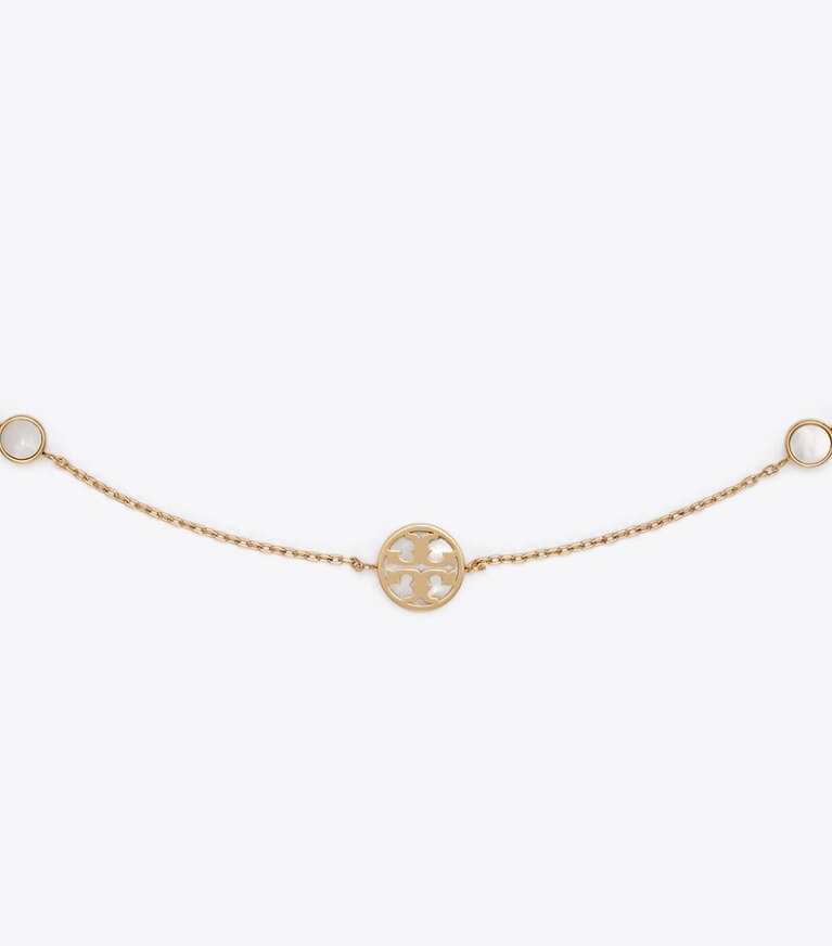 Tory Burch designer colliers Collier Icon en nacre dans Tory Gold / Mother of Pearl détails