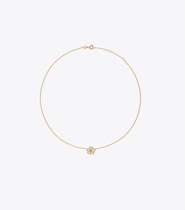 Tory Burch designer colliers Collier pendentif Forget Me Not dans Tory Gold / Mother of Pearl de face