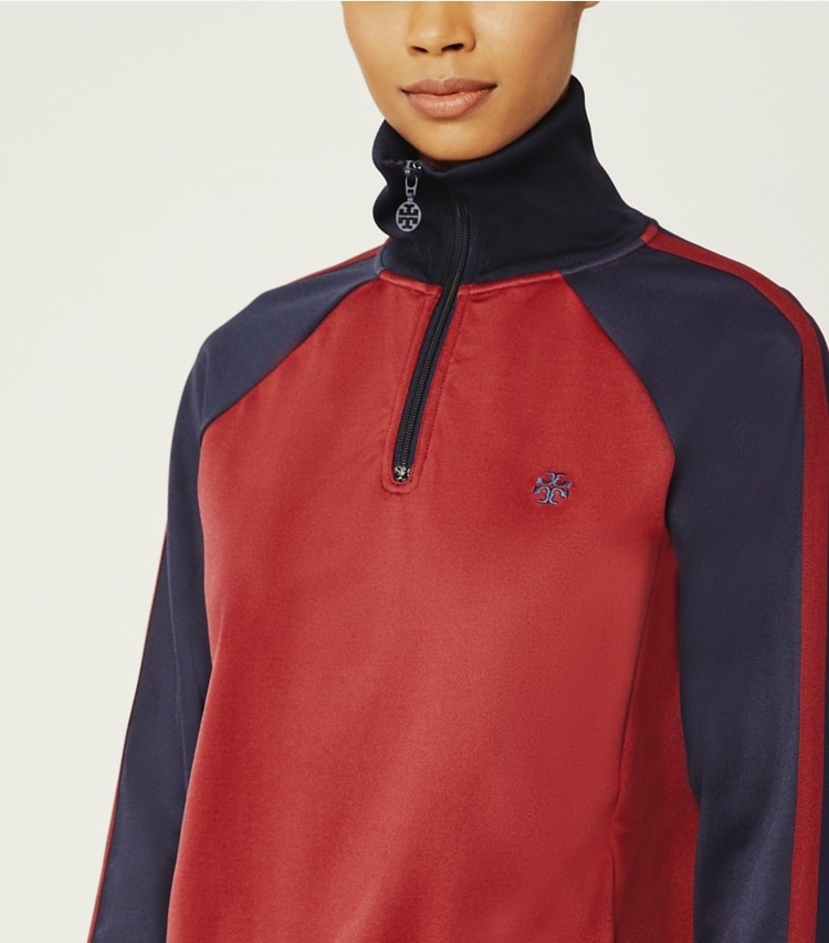 Tory Sport designer jackets Color-Block Half-Zip Pullover in Dark Burgundy/Tory Navy on model detail