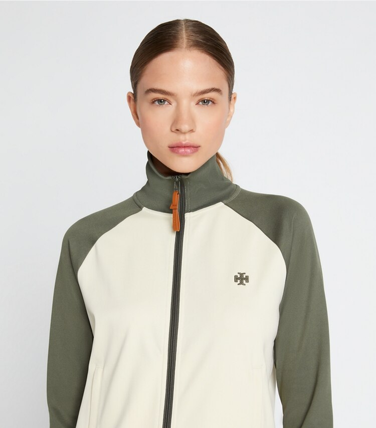 Tory Sport designer jackets Color-Block Zip Track Jacket in Light Olive / Sesame on model detail