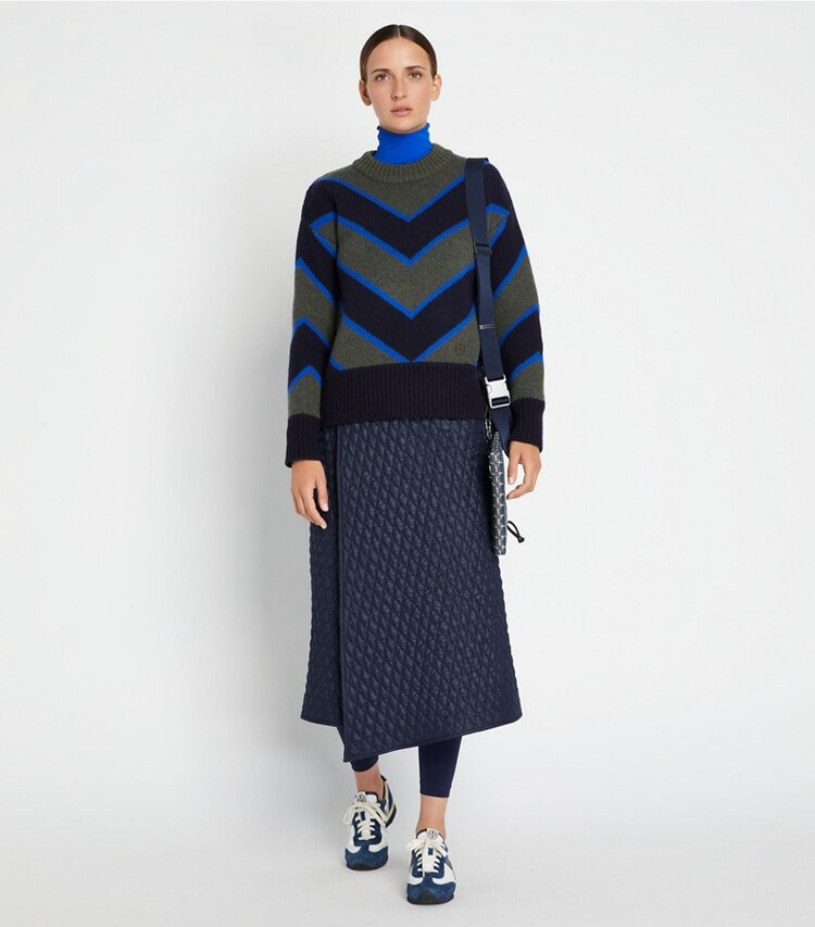 Tory Sport designer sweaters Colorblock Chevron Sweater in Light Olive / Tory Navy on model front