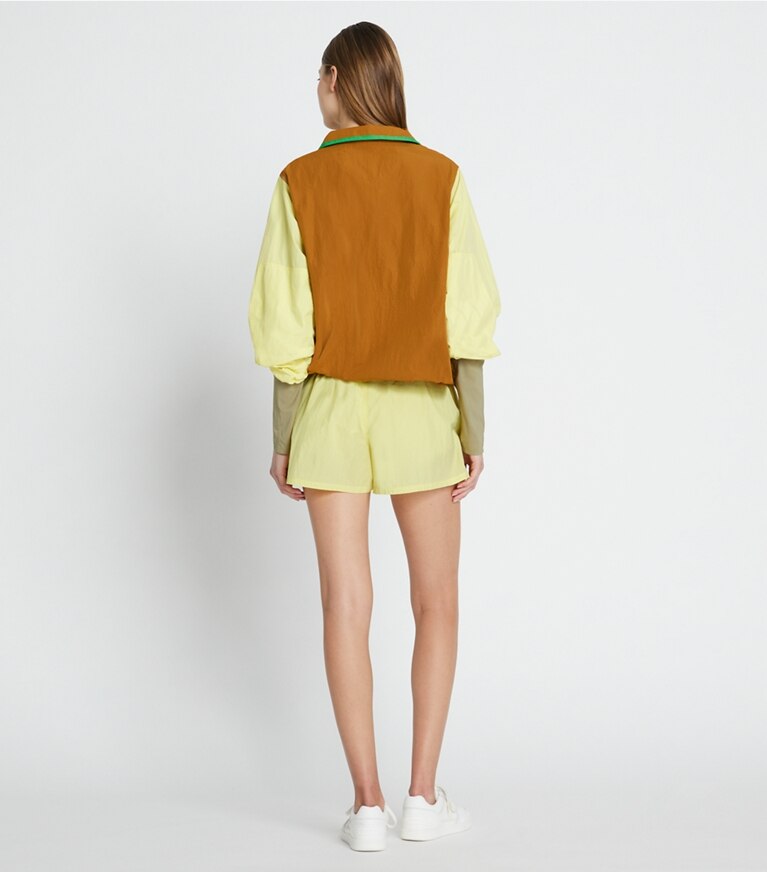 Tory Sport designer ジャケット カラーブロック ナイロン ハーフジップジャケット in Ridge / Yellow Dahlia front