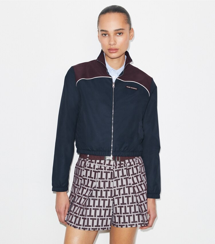 Tory Burch designer jackets Colorblock Nylon Jacket in Medium Navy / Winetasting on model detail