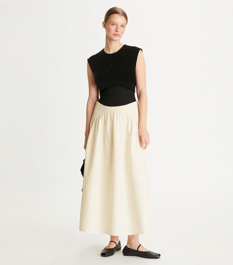 Tory Burch designer dresses Colorblock Pleated Dress in Biscuit on model front