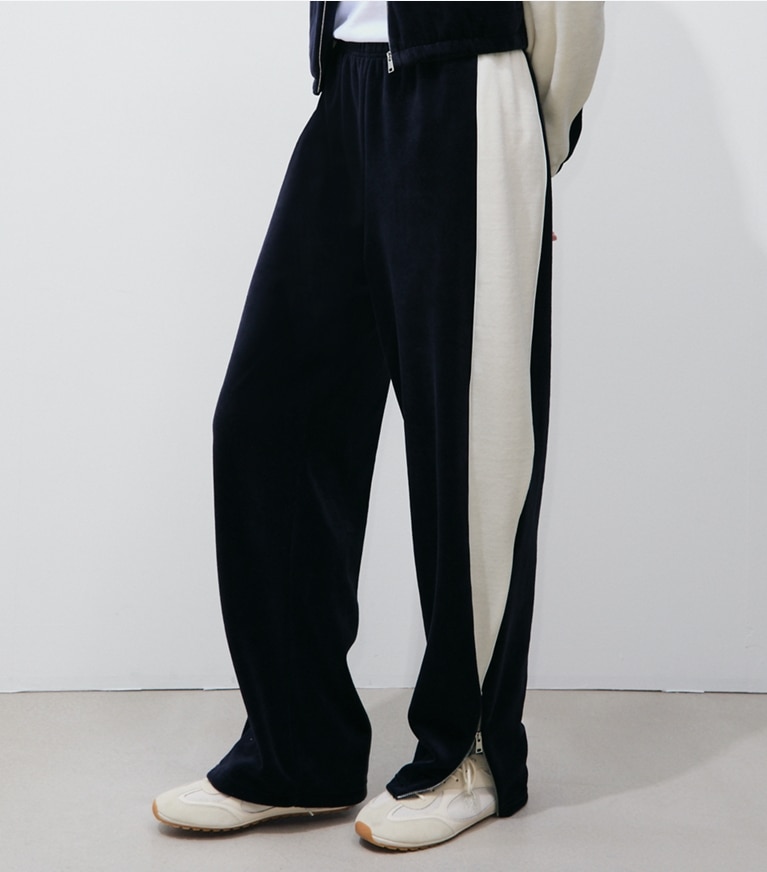 Tory Burch designer bottoms Colorblock Velour Sweatpant in Medium Navy / New Ivory on model detail
