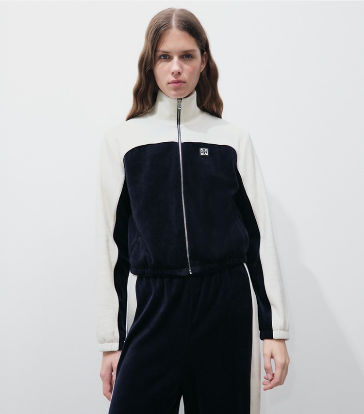 Tory Burch designer jackets Colorblock Velour Track Jacket in Medium Navy / New Ivory on model detail