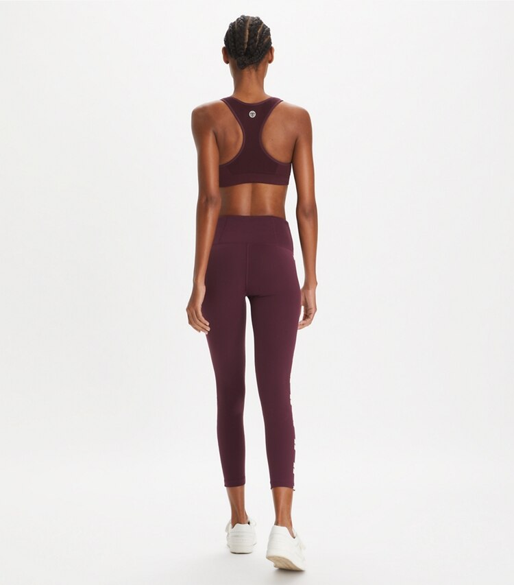 Tory Burch designer bottoms Compression Logo 7/8 Legging in Winetasting on model back