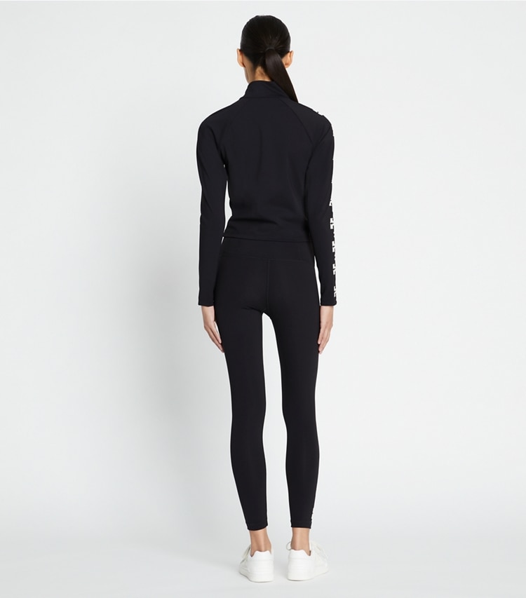 Tory Burch designer bottoms Compression Logo 7/8 Legging in Black T Logo Row on model back