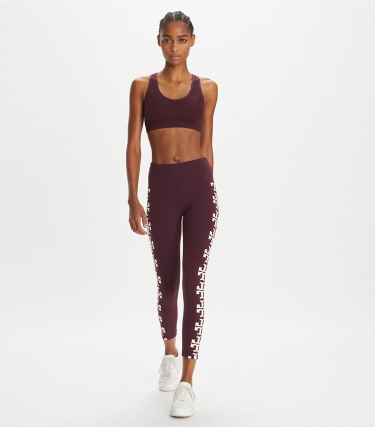 Tory Burch designer bottoms Compression Logo 7/8 Legging in Winetasting on model front
