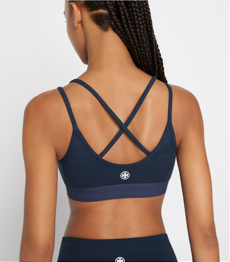 Tory Sport designer sports bras Compression Mélange Cross-Back Bra in Tory Navy Heather on model detail