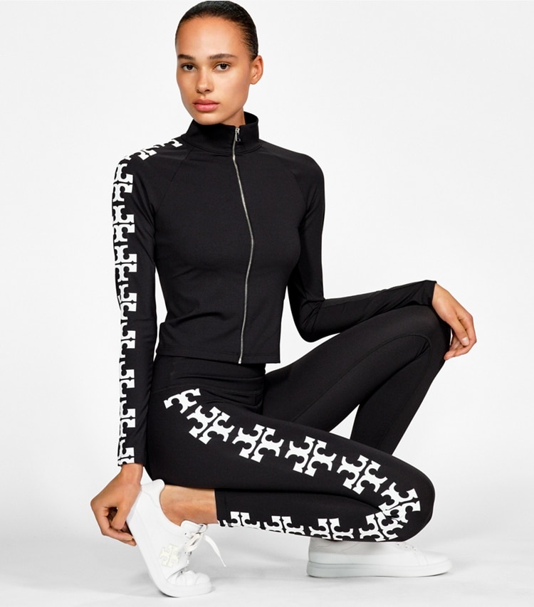 Tory Burch designer bottoms Compression Reflective Logo 7/8 Legging in Black campaign