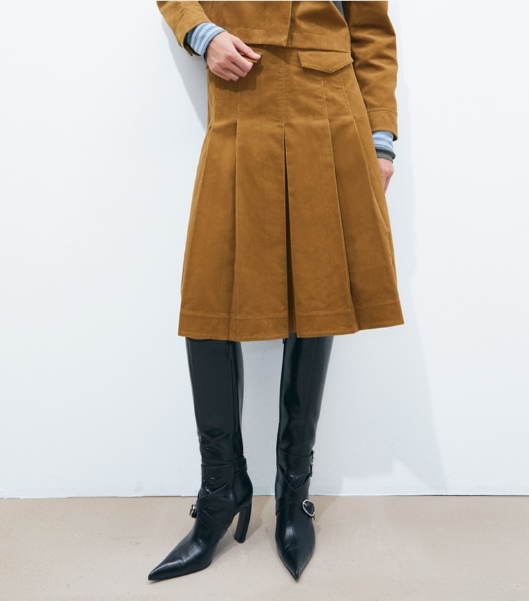 Tory Burch designer bottoms Corduroy Pleated Skirt in Terracotta on model detail