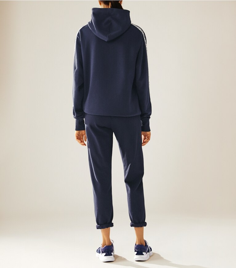 Tory Sport designer bottoms Cotton Terry Sweatpants in Tory Navy on model front