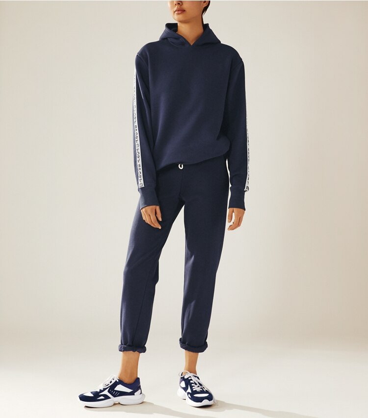 Tory Sport designer bottoms Cotton Terry Sweatpants in Tory Navy on model front