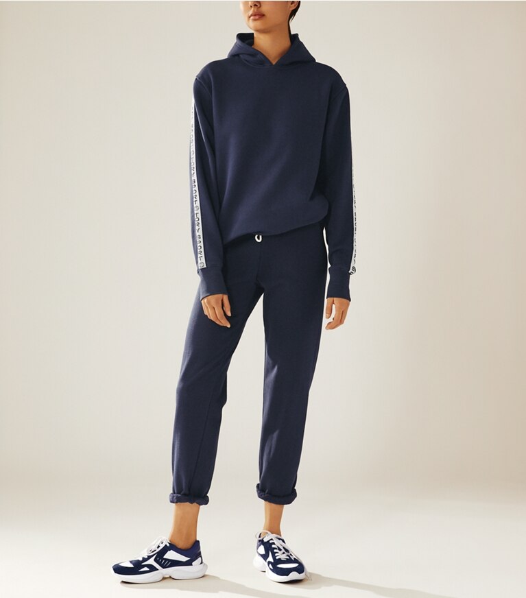 Tory Sport designer bottoms Cotton Terry Sweatpants in Tory Navy on model front
