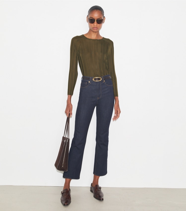 Tory Burch designer bottoms Cropped Flare Jeans in Raw/Unwashed on model front