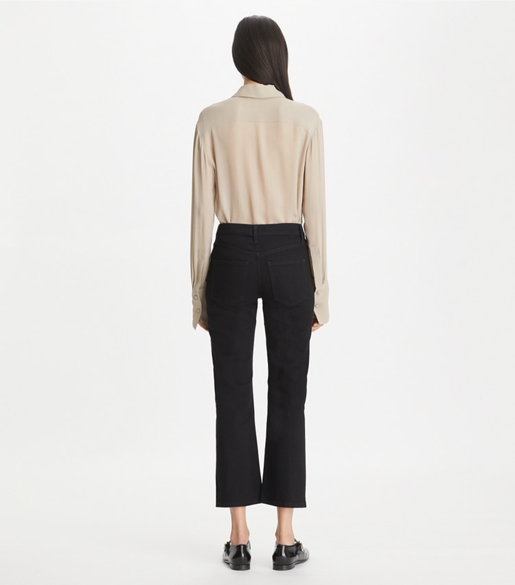 Tory Burch designer bottoms Cropped Kick Flare Jean in Black Rinse Wash on model back