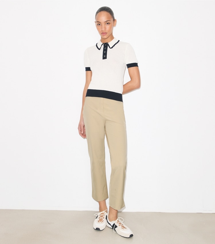 Tory Burch designer bottoms Cropped Stretch Golf Pant in Washed Khaki on model front