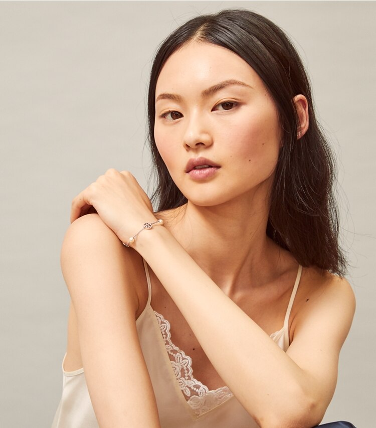 Tory Burch designer bracelets Crystal Pearl Logo Bracelet in Silver/Crystal/Pearl accessory on model