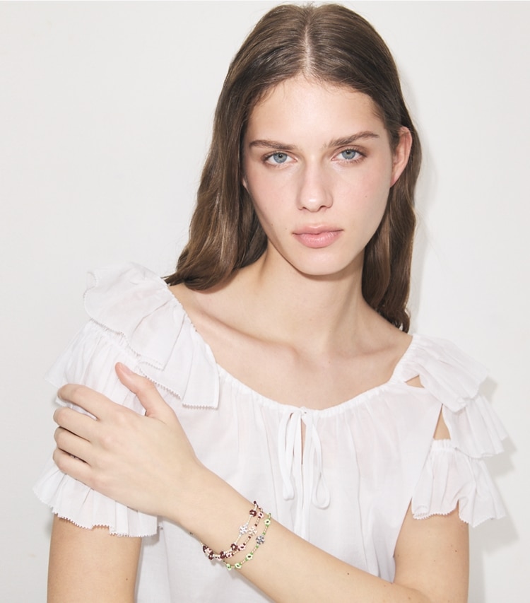 Tory Burch designer bracelets Curiosity Beaded Flower Bracelet in Dark Brown accessory on model