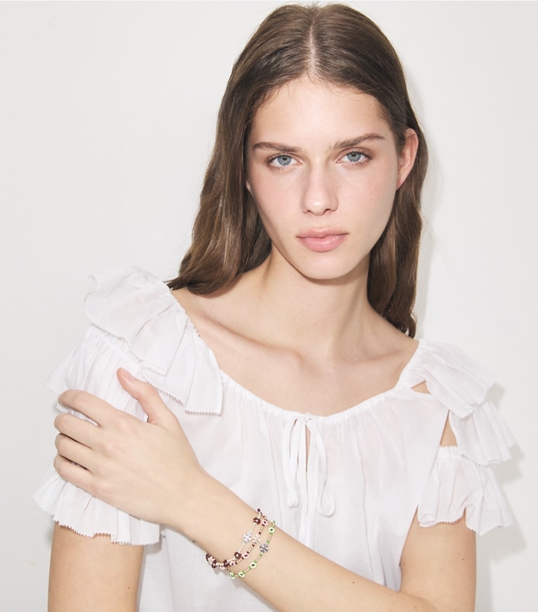 Tory Burch designer bracelets Curiosity Beaded Flower Bracelet in Dark Brown accessory on model