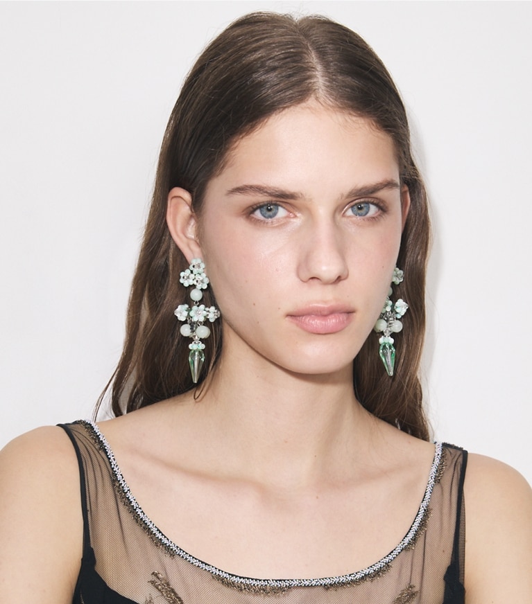 Tory Burch designer earrings Curiosity Beaded Linear Earrings in Tory Gold / Brown accessory on model