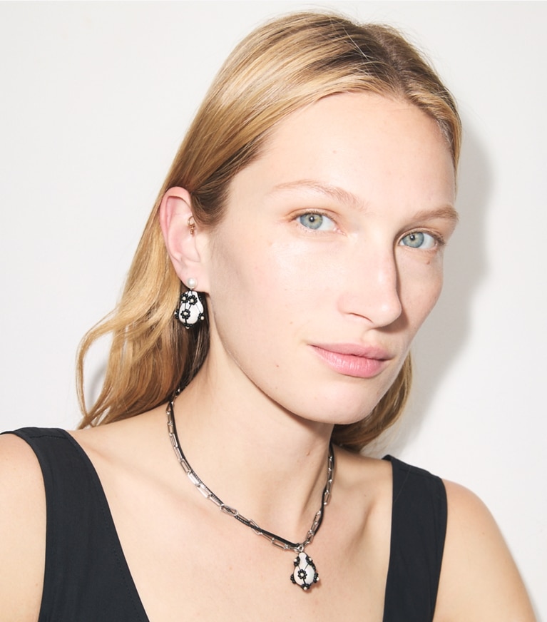 Tory Burch designer earrings Curiosity Beaded Pearl Drop Earrings in Tory Silver / Black accessory on model