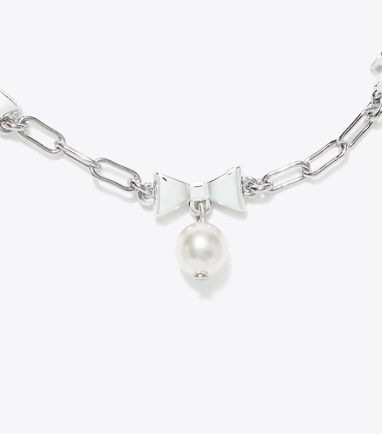 Tory Burch designer ブレスレット キュリオシティ ボウ ブレスレット in Tory Silver / Pearl front