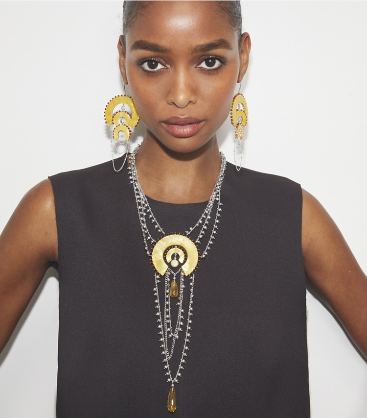 Tory Burch designer earrings Curiosity Chandelier Earrings in Antique Light Silver / Yellow accessory on model