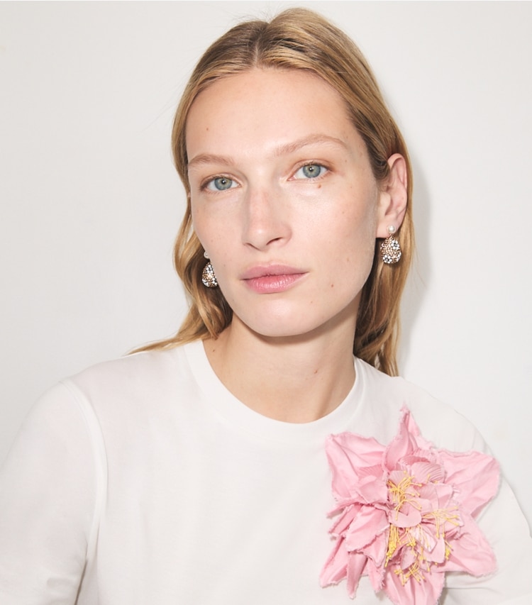 Tory Burch designer earrings Curiosity Crystal Pearl Drop Earrings in Tory Gold / Light Brown accessory on model