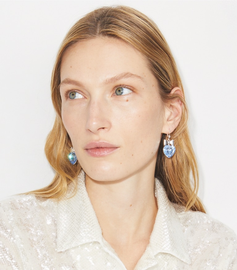 Tory Burch designer earrings Curiosity Heart and Bow Earrings in Tory Gold / Crystal front