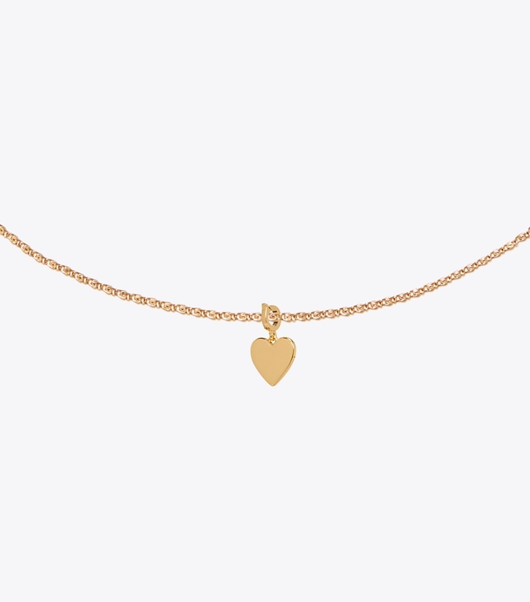 Tory Burch designer hair pins Curiosity Heart Charm in Light Brass detail
