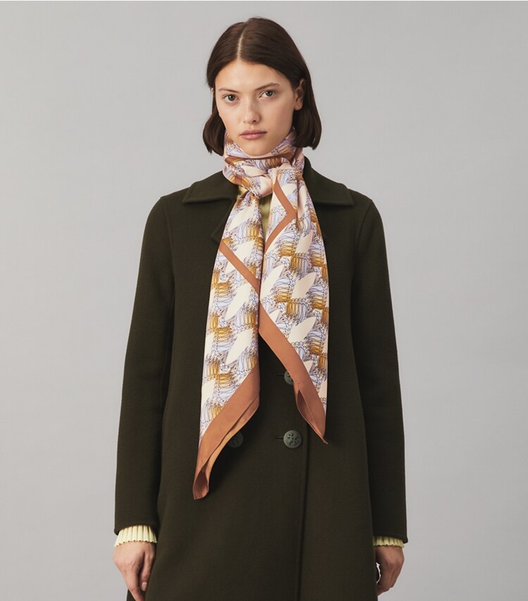 Tory Burch designer scarves Deco Crane Geo Logo Oversized Silk Square Scarf in SAND DECO CRANE GEO accessory on model