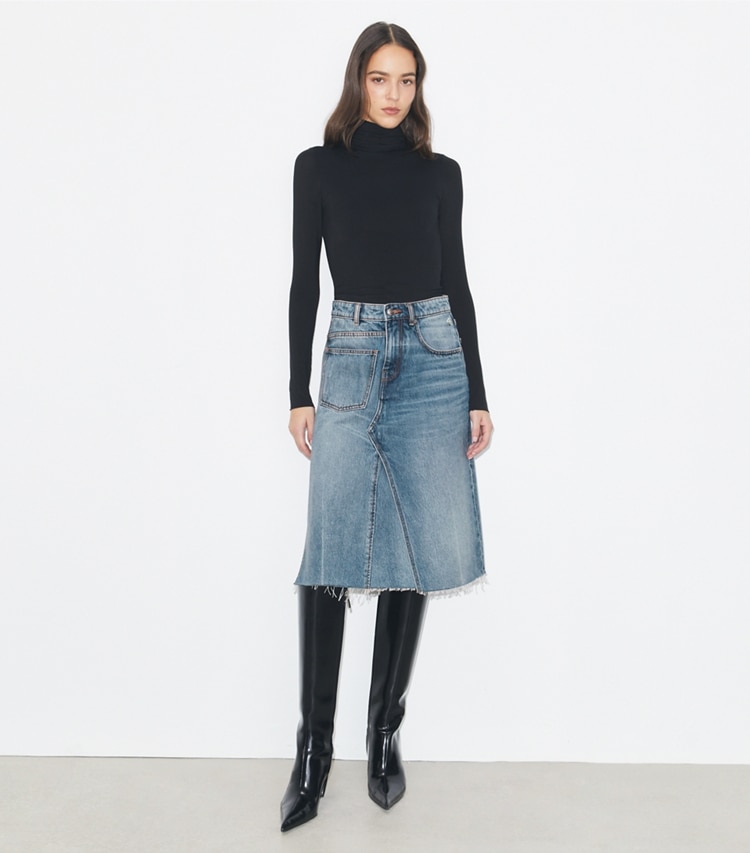 Tory Burch designer bottoms Deconstructed Denim Skirt in Worn Vintage Wash on model front
