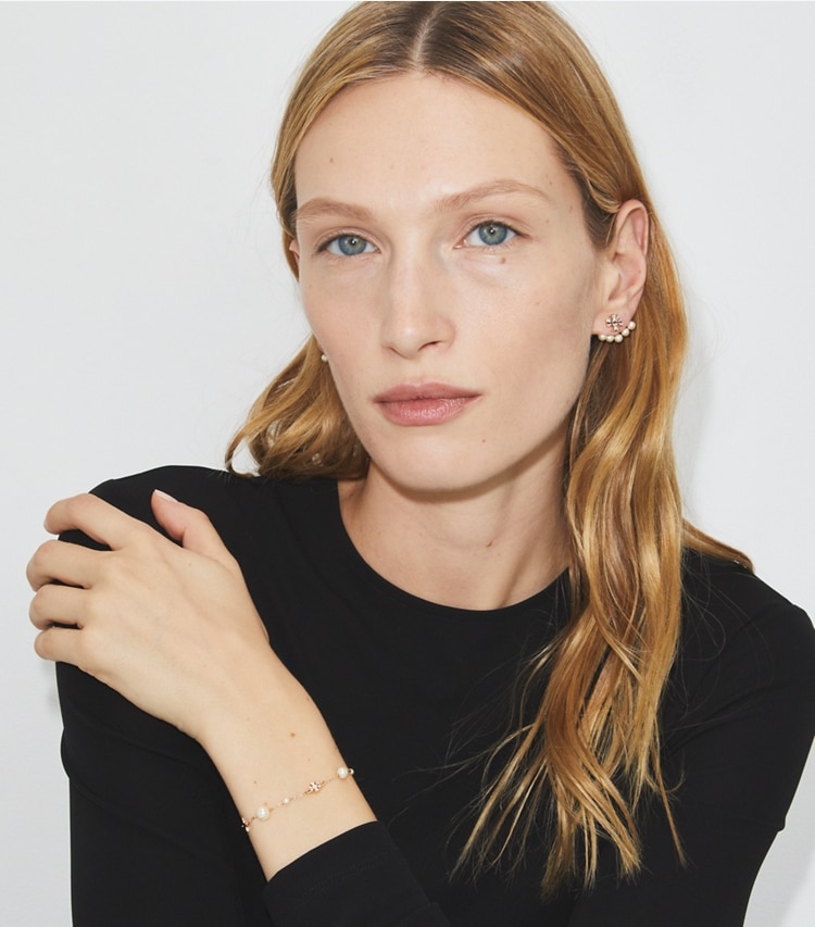 Tory Burch designer bracelets Delicate Moondance Pearl and Star Bracelet in Tory Silver / Light Sapphire / Pearl accessory on model