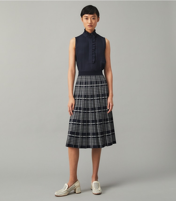 Tory Burch designer tops Deneuve Shell in Tory Navy on model front
